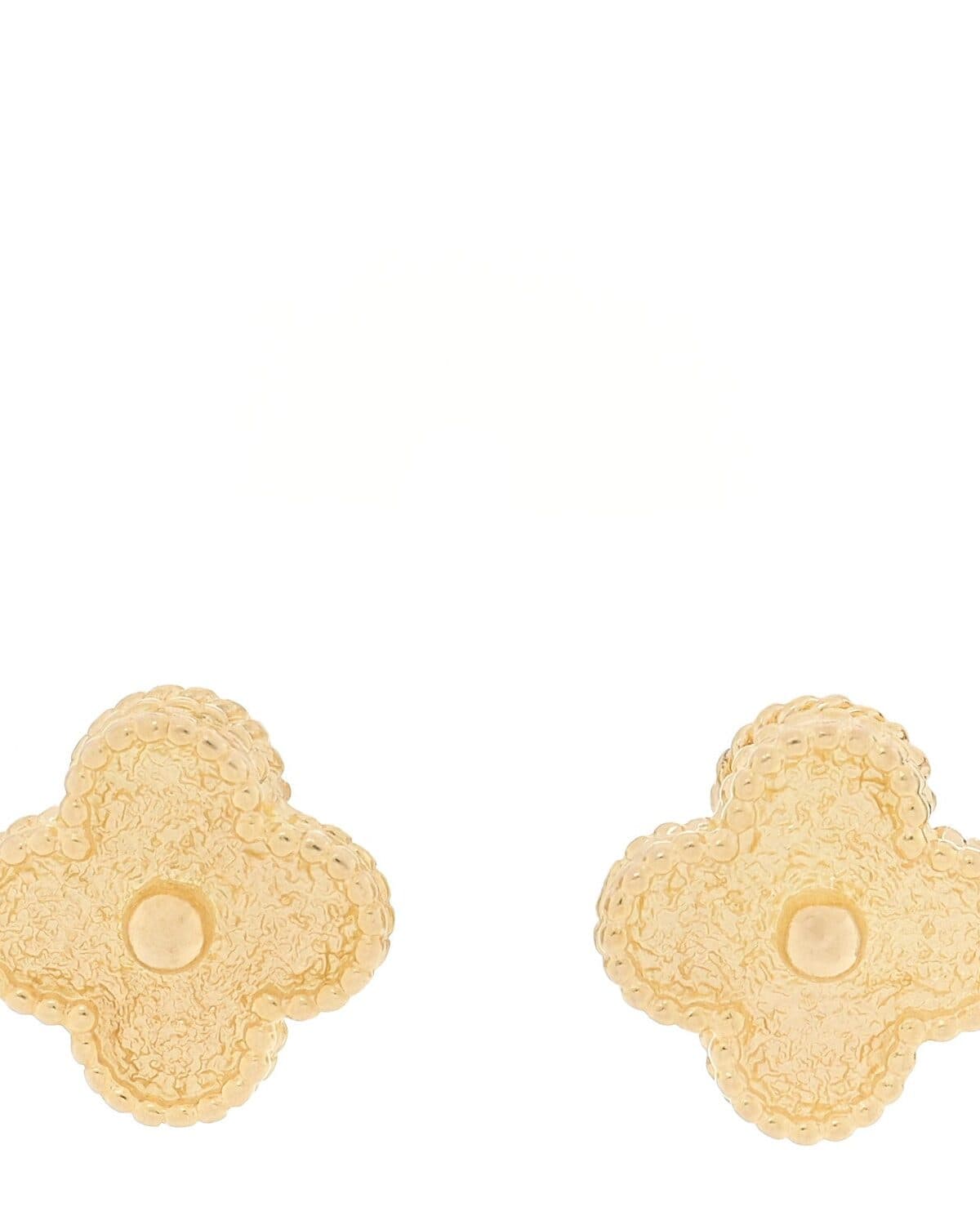 Pearl drop earrings photographed on a neutral ground