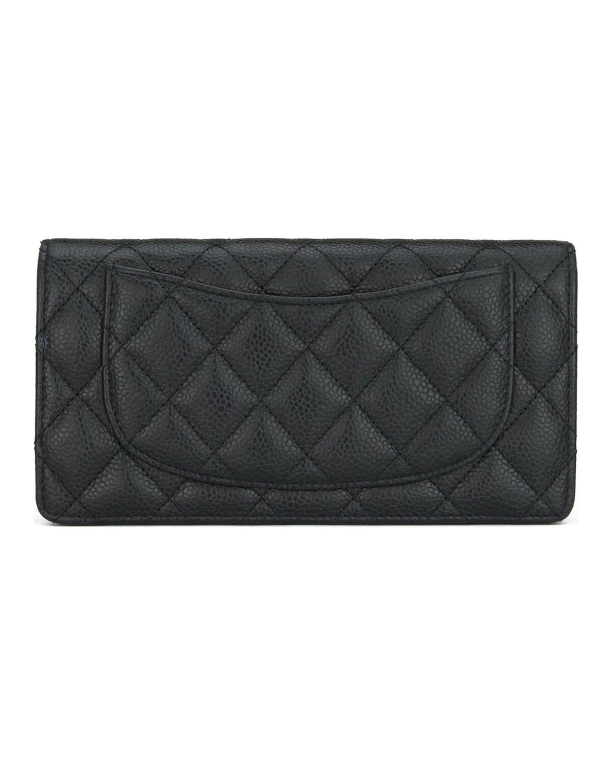 Quilted long flap wallet photographed on a neutral ground