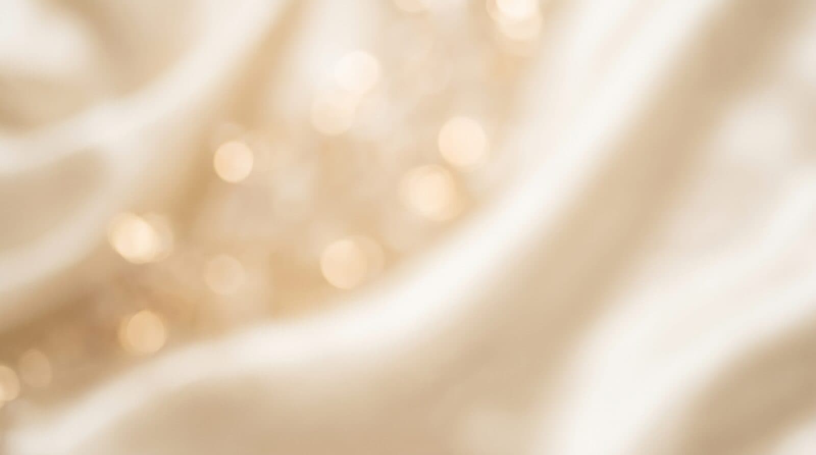 A champagne-toned surface catching warm light