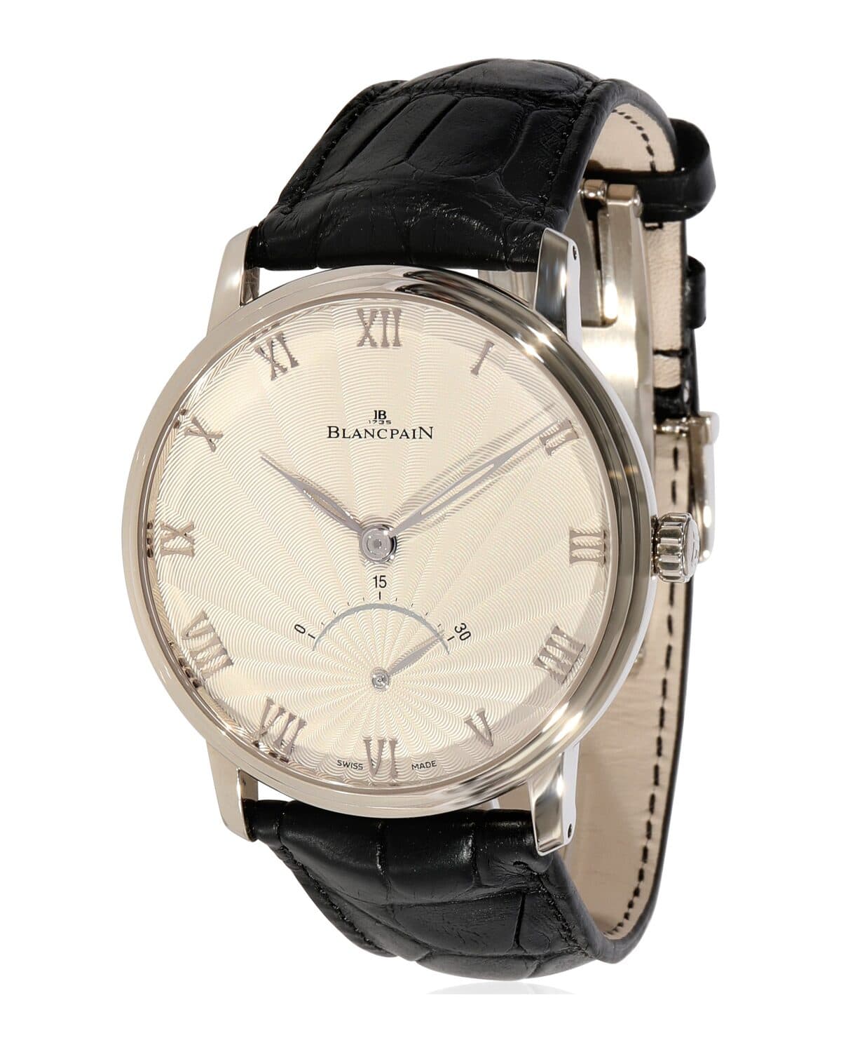 Cream dial, leather strap photographed on a neutral ground